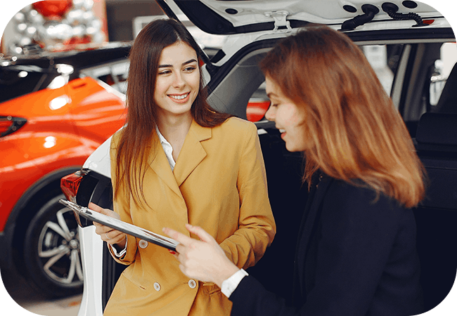 Two people discussing an automotive purchase
